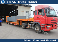 Customized dimensions tri - axle 60 tons low bed trailer With hydraulic ramps supplier